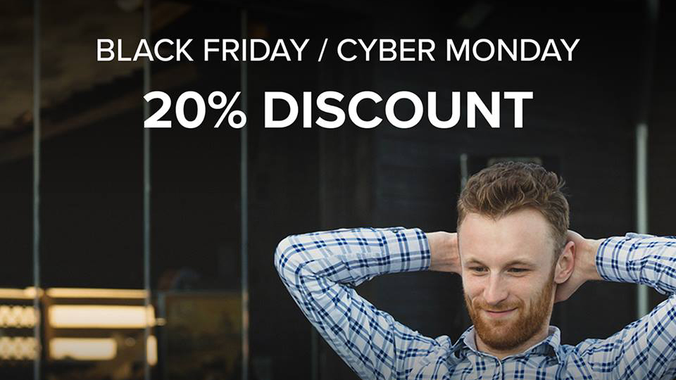 Relaxed person with a laptop and Black Friday / Cyber Monday discount offer
